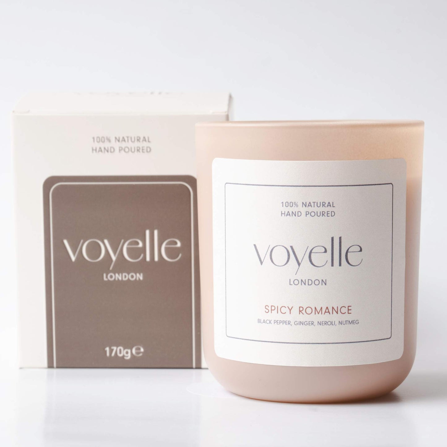 Voyelle Spicy Romance scented candle with packaging on white background
