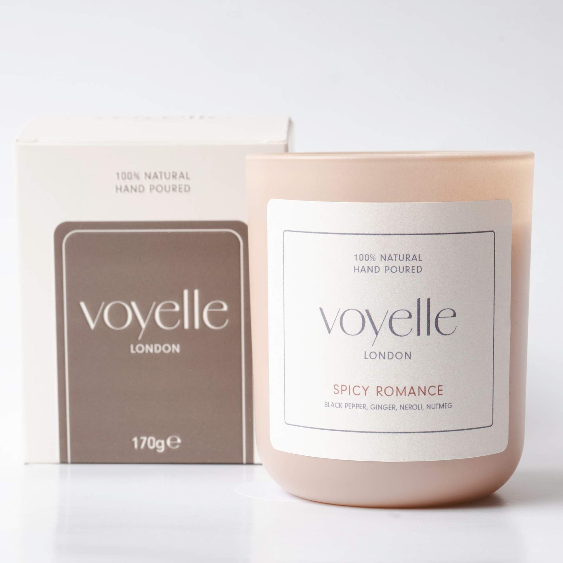 Voyelle Spicy Romance scented candle with packaging on white background