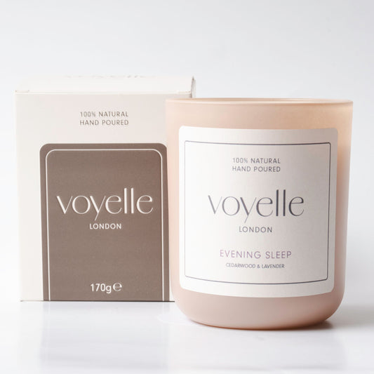 Voyelle London candle labeled "Evening Sleep" with packaging, placed on a white background