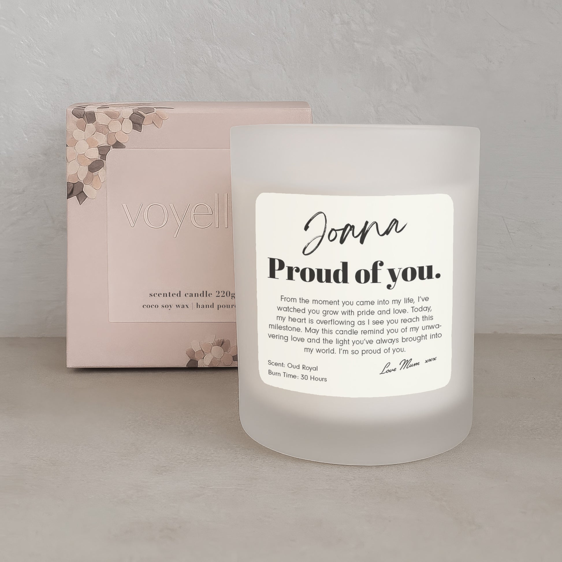 Frosted candle with a label and packaging in the background
