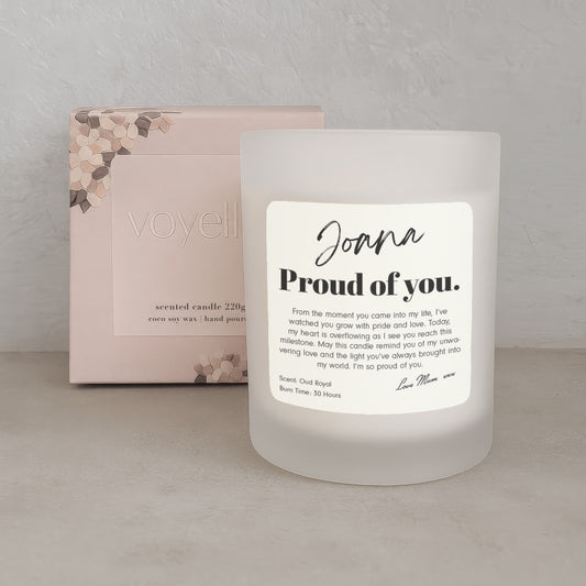 Frosted candle with a label and packaging in the background