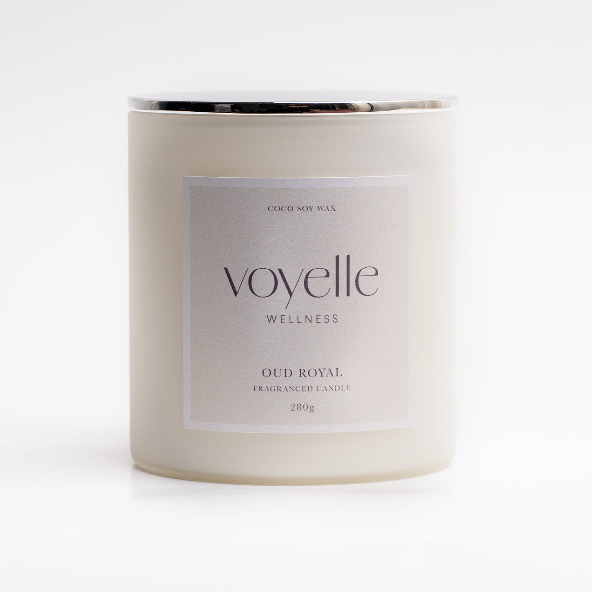Oud Royal candle lit in a dark interior — wood, patchouli & amber