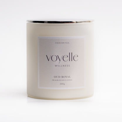 Oud Royal candle lit in a dark interior — wood, patchouli & amber