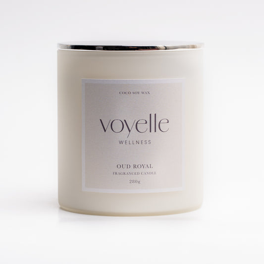 Oud Royal candle lit in a dark interior — wood, patchouli & amber