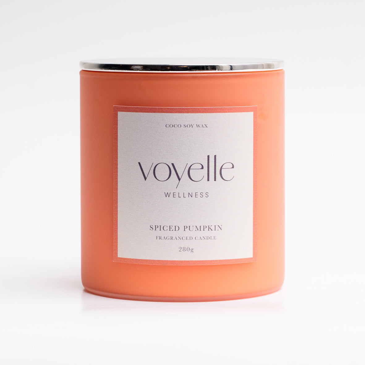 Spiced Pumpkin candle lit in a cosy autumn scene — pumpkin, clove & vanilla