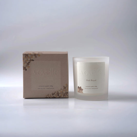 Hand-poured Oud Royal soy candle by Voyelle in frosted glass jar with eco packaging – luxury home fragrance
