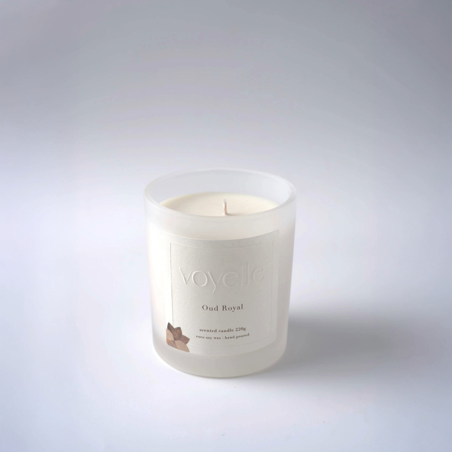 Voyelle Oud Royal scented candle in frosted glass on white background