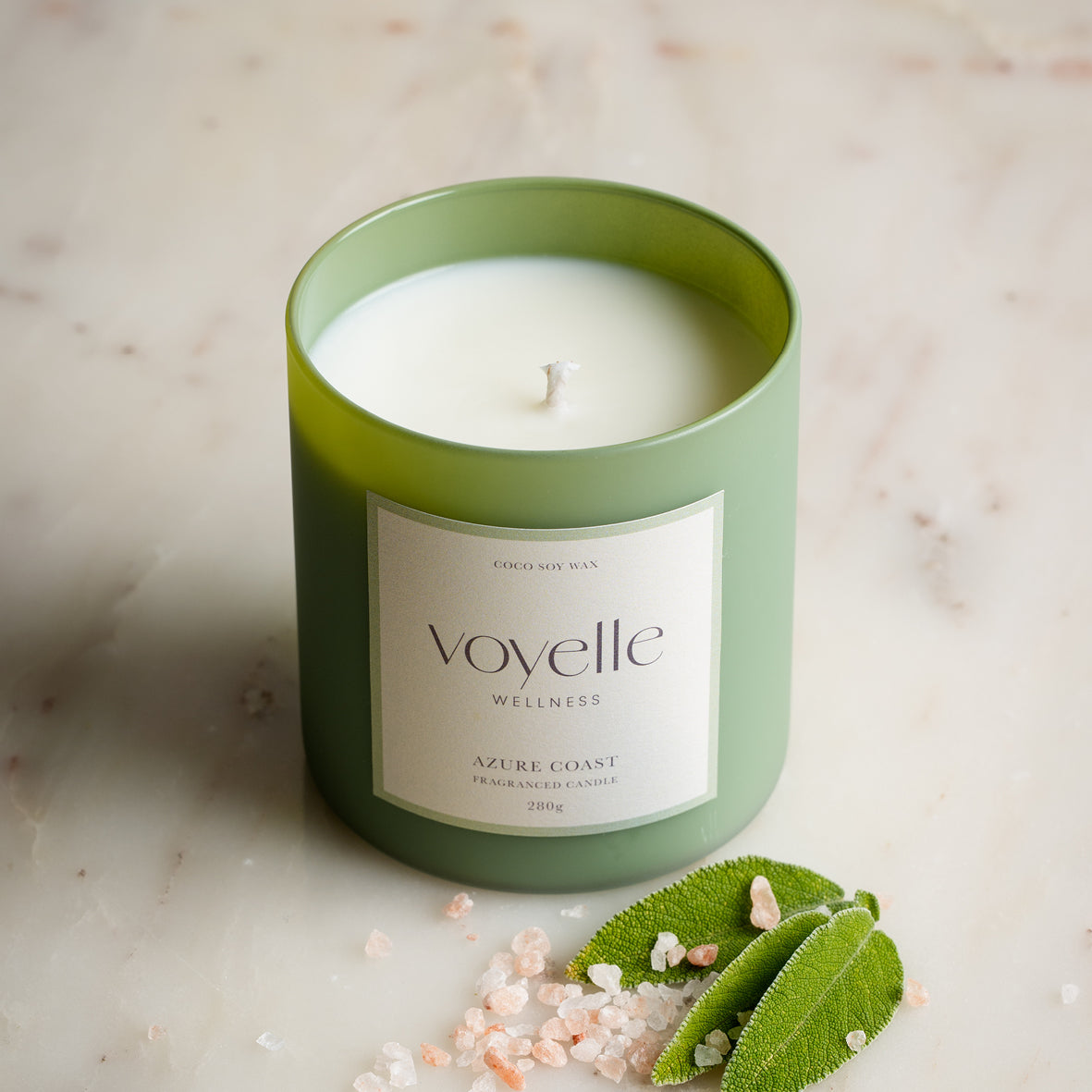 Azure Coast sage-green glass candle with salt crystals and sage leaves