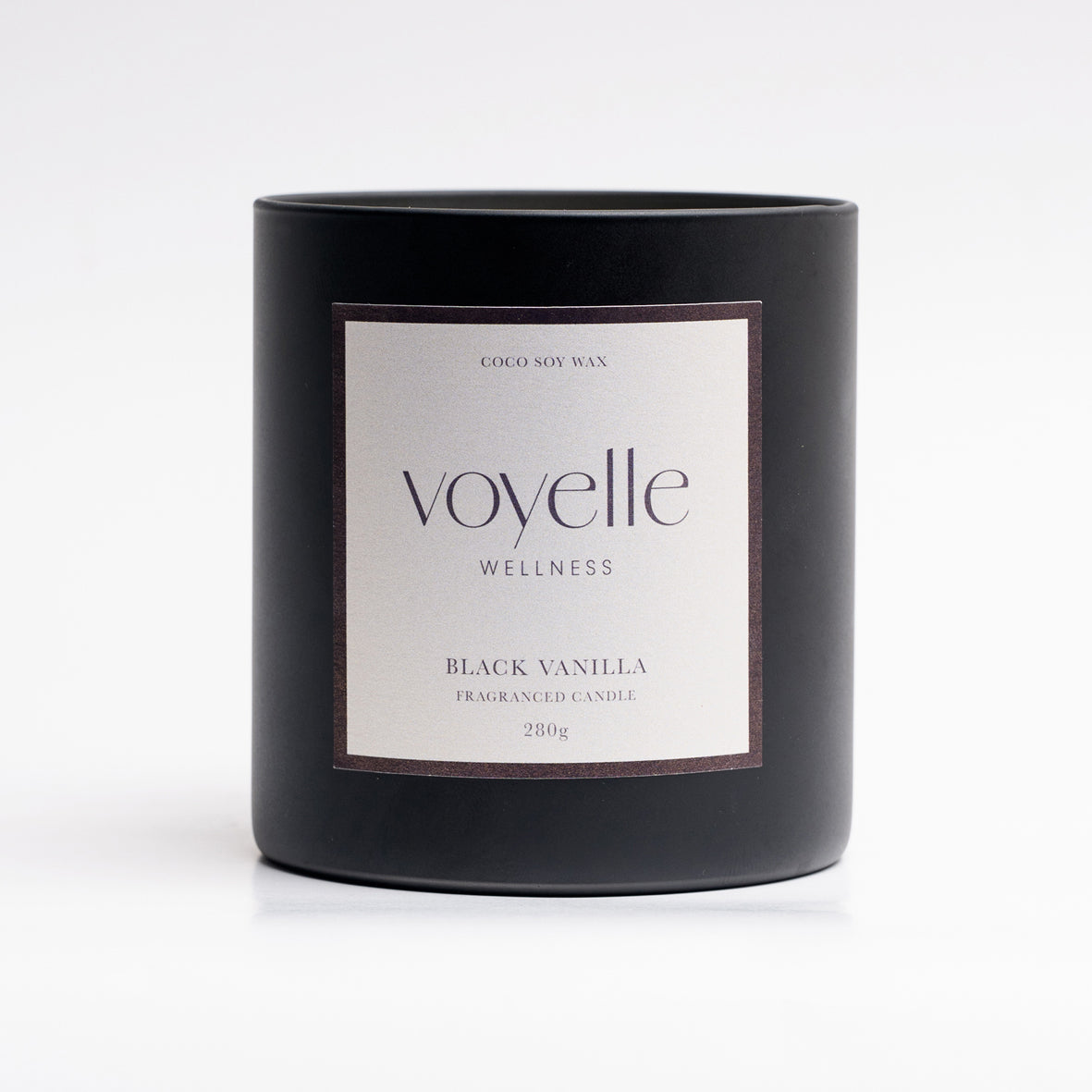 Black Vanilla matte black candle vessel with cream label, studio portrait