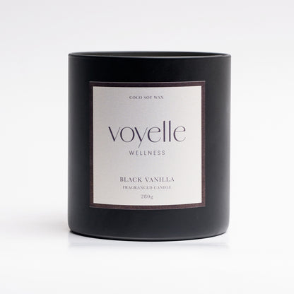 Black Vanilla matte black candle vessel with cream label, studio portrait